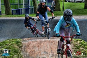 Action shot of Children racing Mile End Park's BMX Course