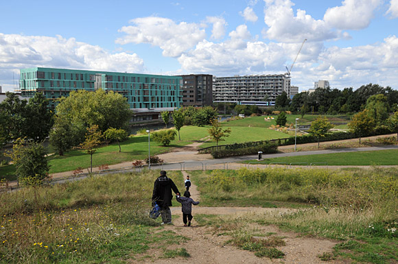 FAther and Child descend from Mile End Park's Sunset Hill