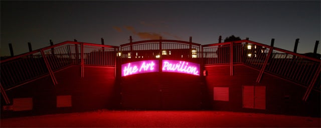 The Art Pavilion exterior with illuminated "The Art Pavilion" signage