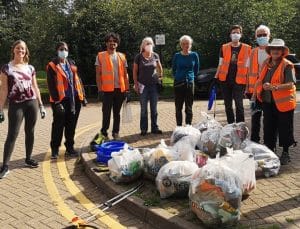 The volunteer litter picking team with bags of collected rubbish