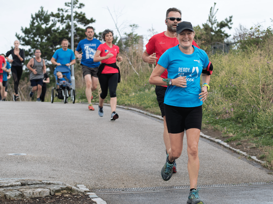parkrunners on the Mile End Green Bridge